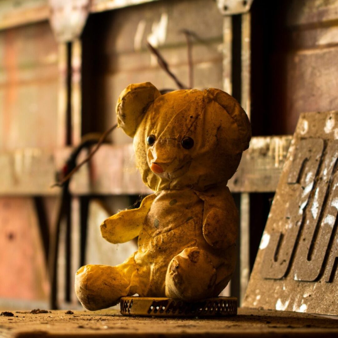 A teddy bear sitting on top of a table.